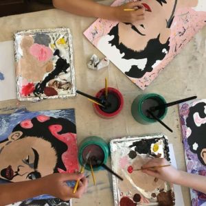 Kids painting Frida's portrait at their art club with Arty Amber, overview